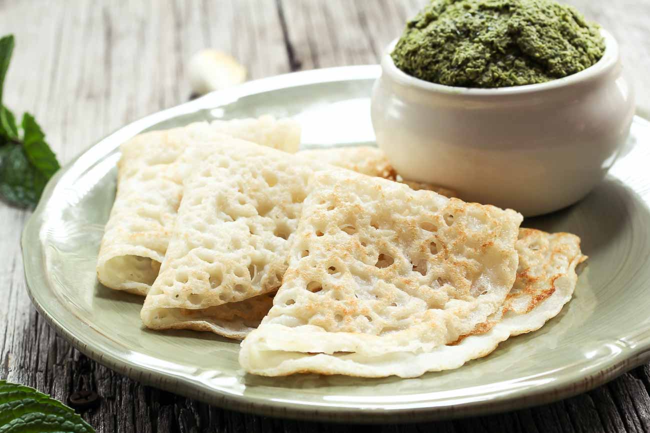 Ghavan is a traditional Maharashtrian rice crepe made from rice and urad flour, along with a little water, to create a thin batter. Add salt to the thin and runny batter. Lightly grease a pan with oil, pour the batter with a small cup, and make a thin pancake. Cook on a medium flame for 1 minute and flip. Serve it with coriander and coconut chutney or spicy red curry.