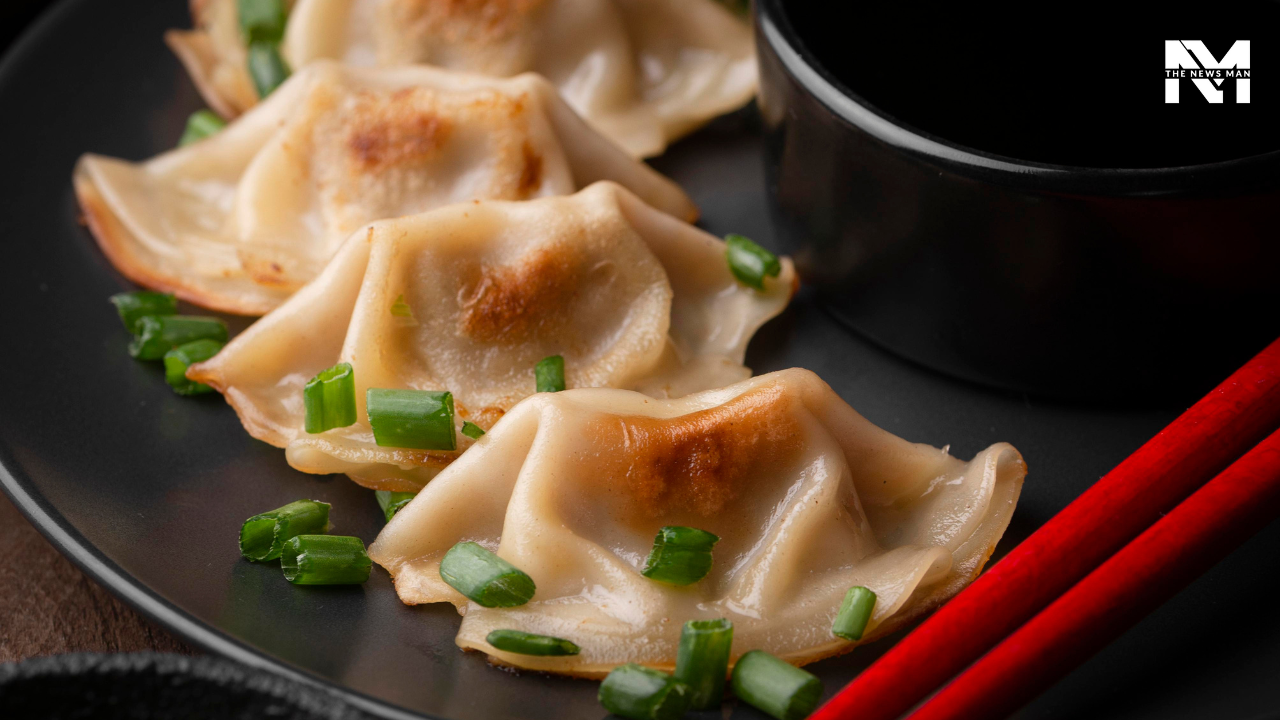 Prepared as part of the Korean Lunar New Year festivities, Mandoo are Korean dumplings symbolizing good luck. They are either added to beef or anchovy broth or accompanied by tteok manu guk, a traditional cylindrical rice cake.