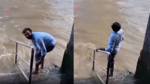 Man Washing his Feet in Thames River in London