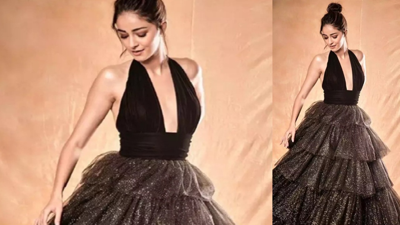 A ballerina-style long gown could be the best option. It gives you a doll look. Ananya Pandey is looking really cute in this black and grey colored fancy gown.