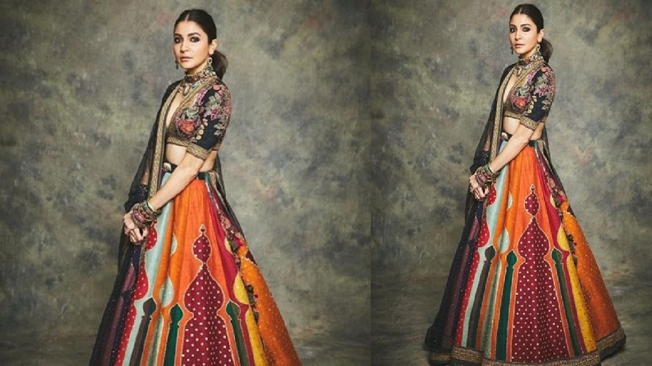 You can wear a multicolored/designed patchwork-styled/embroidered lehenga with a designer blouse and slik dupatta. It will give you a desi look.