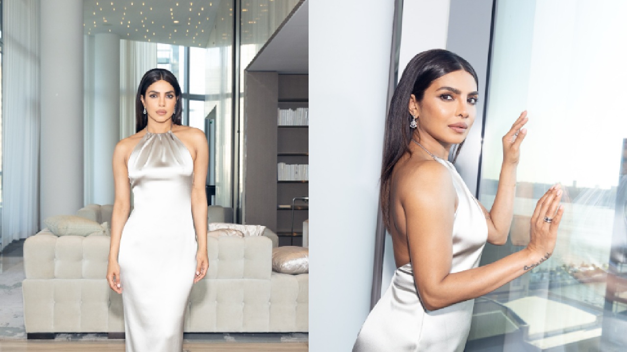 A glossy closed neck styled silver gown is a perfect option for gala night. This look gives you royal vibes. You can match diamond earrings with this look.