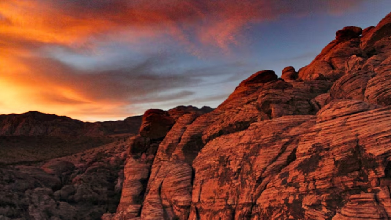The vivid red and orange rock formations and multicolored sands of Rainbow Valley in Australia's Northern Territory. (Disclaimer: Given the input is on an information basis, please seek professional advice.)