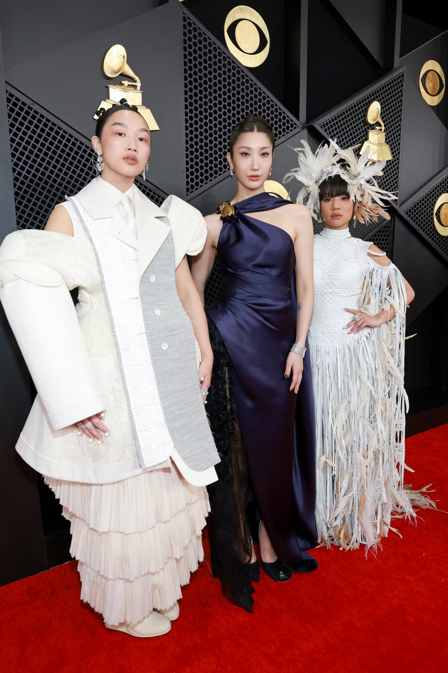 Huntrix stars from K Pop Demon Hunters, Audrey Nuna, EJAE, and Rei Ami wear Thom Browne, Dior, and Guvanch.