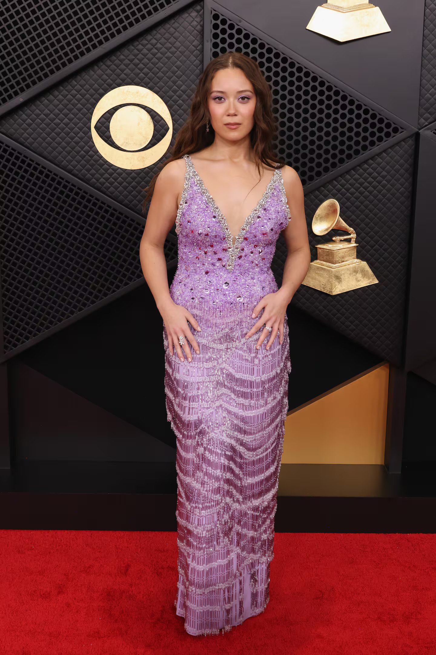 Laufey captivates the attention of all in an alluring purple gown by Miu Miu.