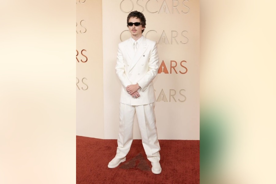 Nominated for his performance in Marty Supreme, Timothee Chalamet slayed in a double-breasted white suit at the 98th Oscars red carpet